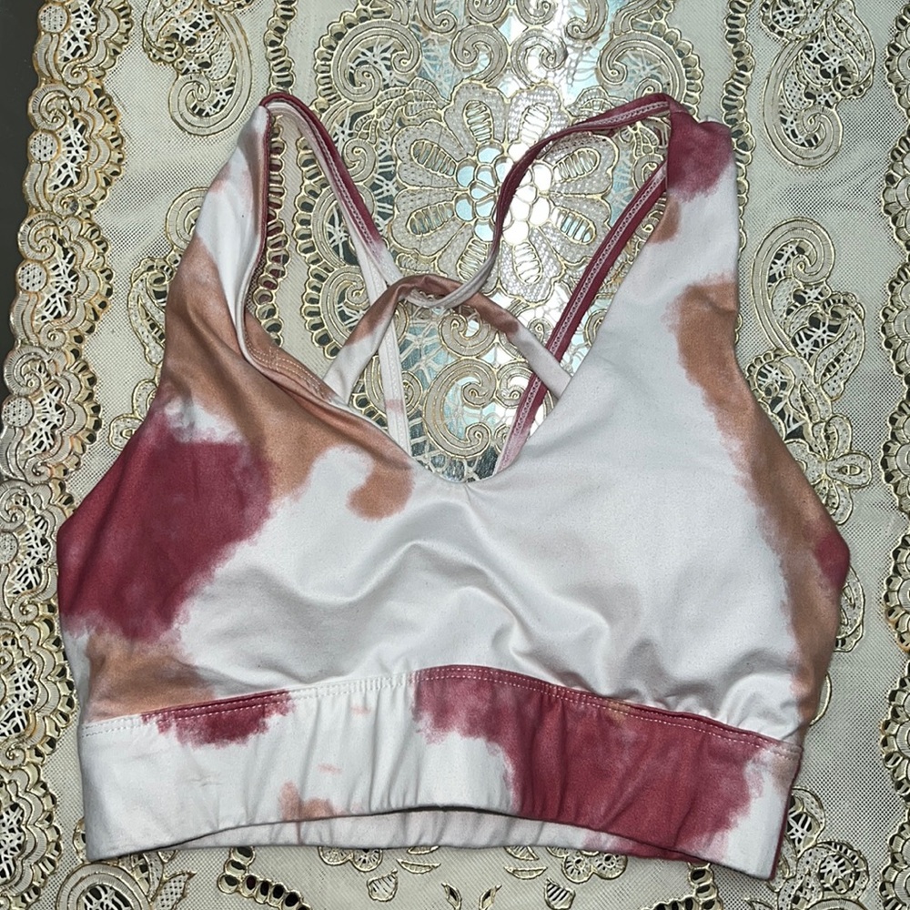White sports bra with red and orange abstract print